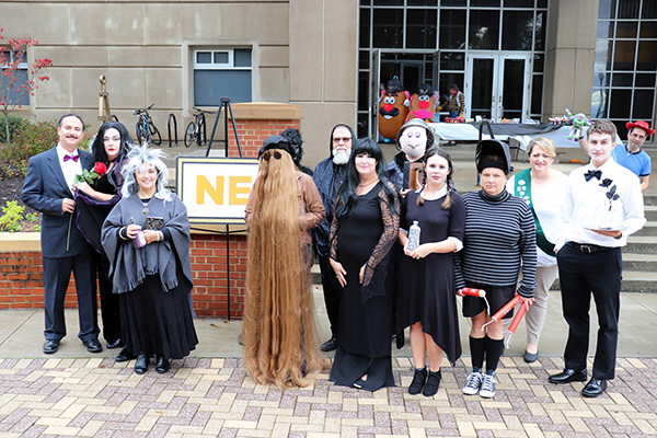 The NE department earned second place with their Addams (or Atoms?) Family costumes.