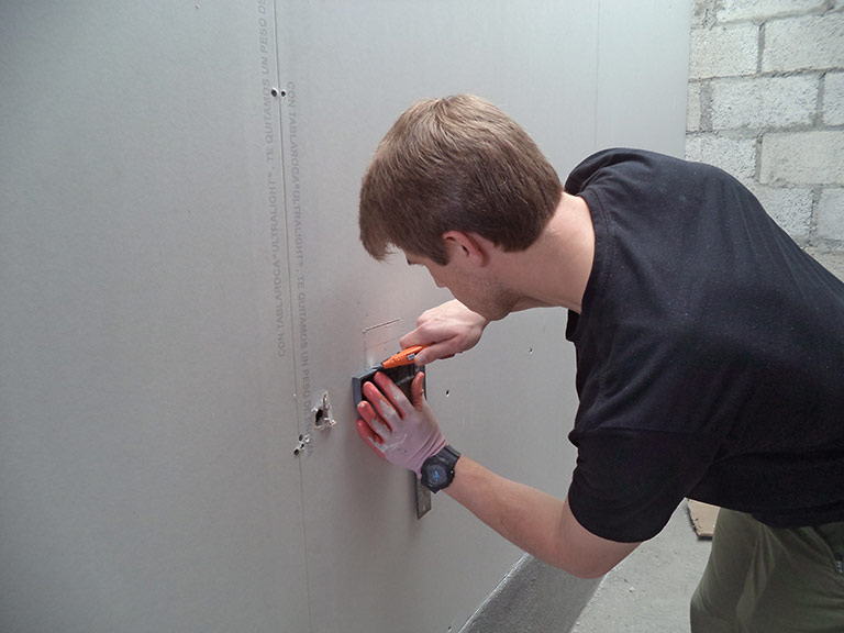 Samuel Scruggs installing Junction Box