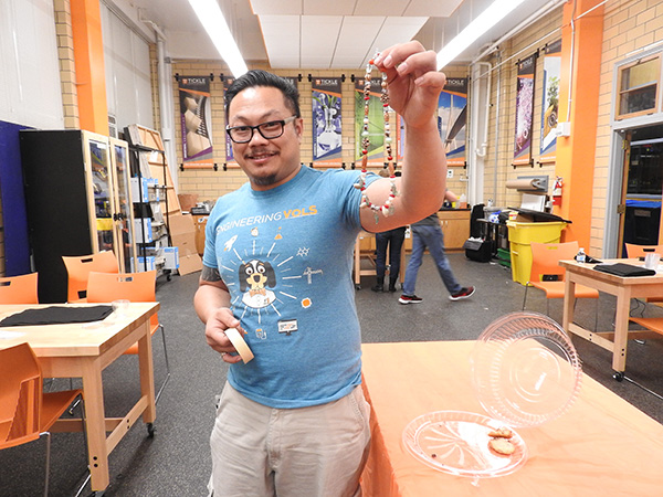 Tom Duong showed Project BEAD students around the ICS—and showed off some beads of his own.