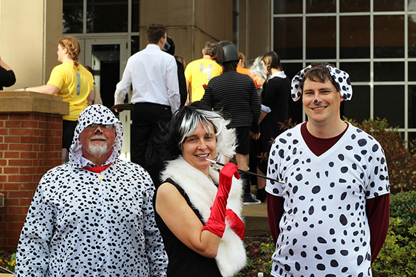 MSE head Verle Keppens does her best "Cruella Deville" with a pair of her Dalmatians, Frank Hollway and Eric Lass.