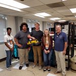 Nuclear engineering professor Lawrence Heilbronn, far right, led HITES12 students on a robotic investigation for radiation detection.