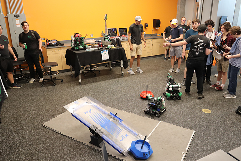 Students from YNOT showing off robots