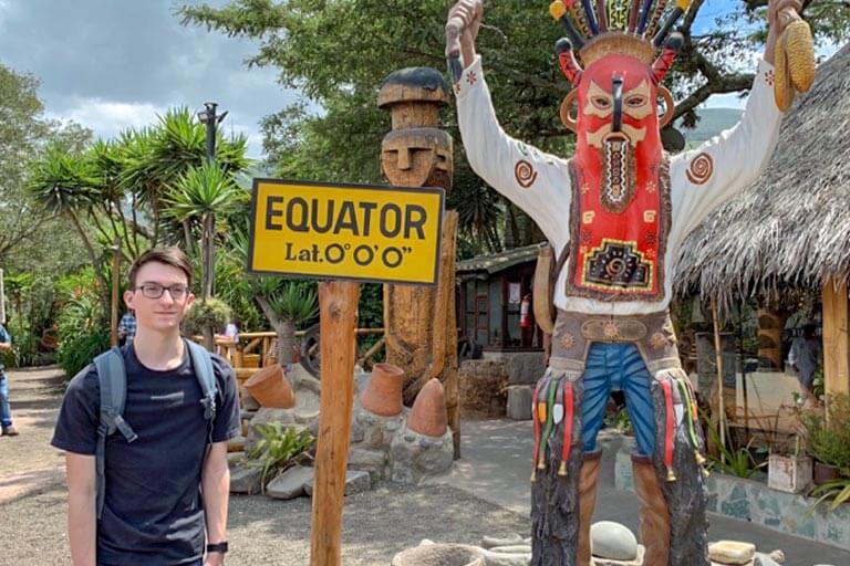 Presnell standing at the Equator