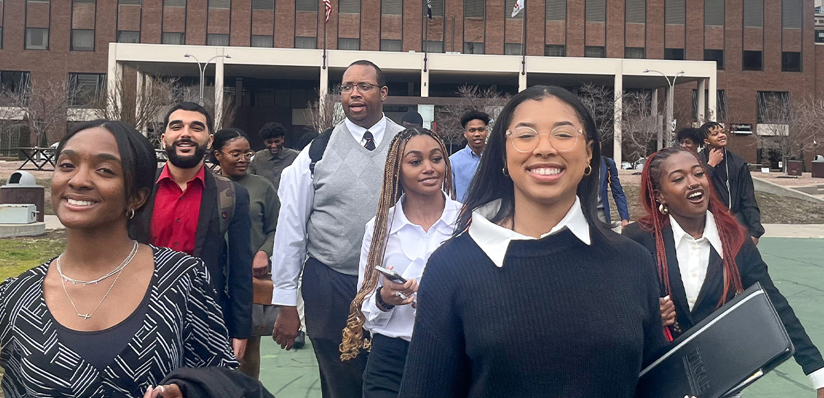 2023 National Society of Black Engineers members walk with Travis Griffin in Kansas City.