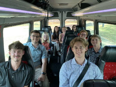 ISE495 Study Abroad students ride in a van in route to Mercedes-Benz.