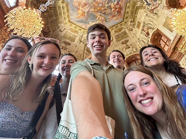 Alyson Champion and other Engineering in London study abroad participants stand together for a group "selfie".