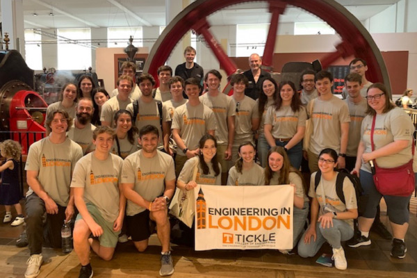 Engineering in London study abroad group photo. The students at the front of the group are holding an "Engineering in London" banner adorned with the Tickle College of Engineering logo.
