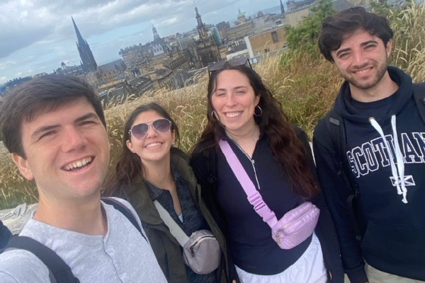 Cameron Castleberry and other study abroad students stand together for a group photo overlooking the city of London from an elevated position.