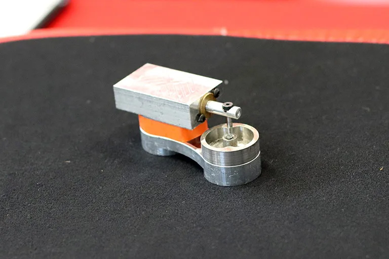 Student teams machined components for an oscillating piston air engine.
