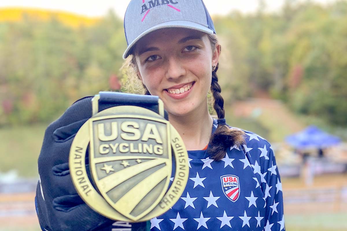 Avah Cherry holds up USA Cycling National Championships medal