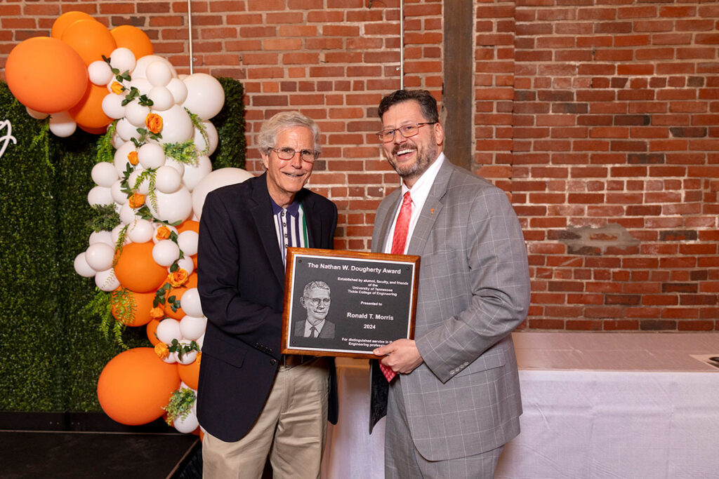 Ronald Morris posing with the Dougherty Award and Dean Mench