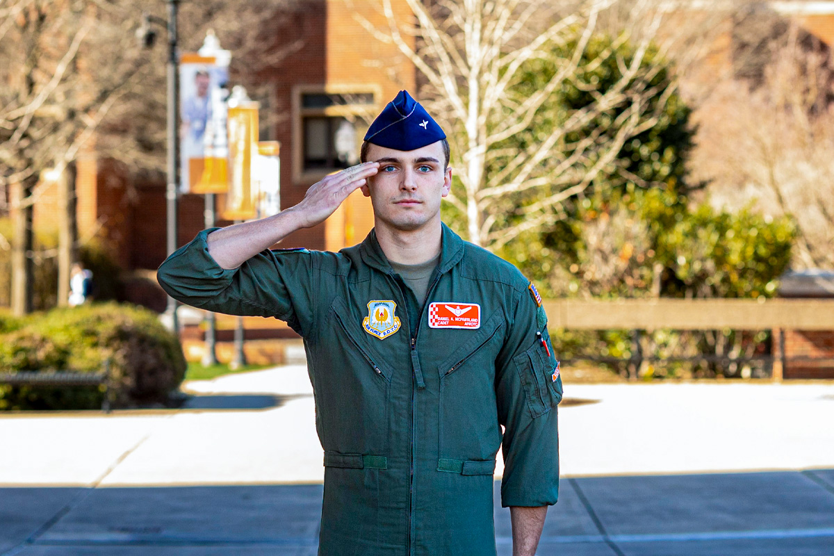 Air Force ROTC Cadet Daniel McPartland leads march in Humanities Plaza.