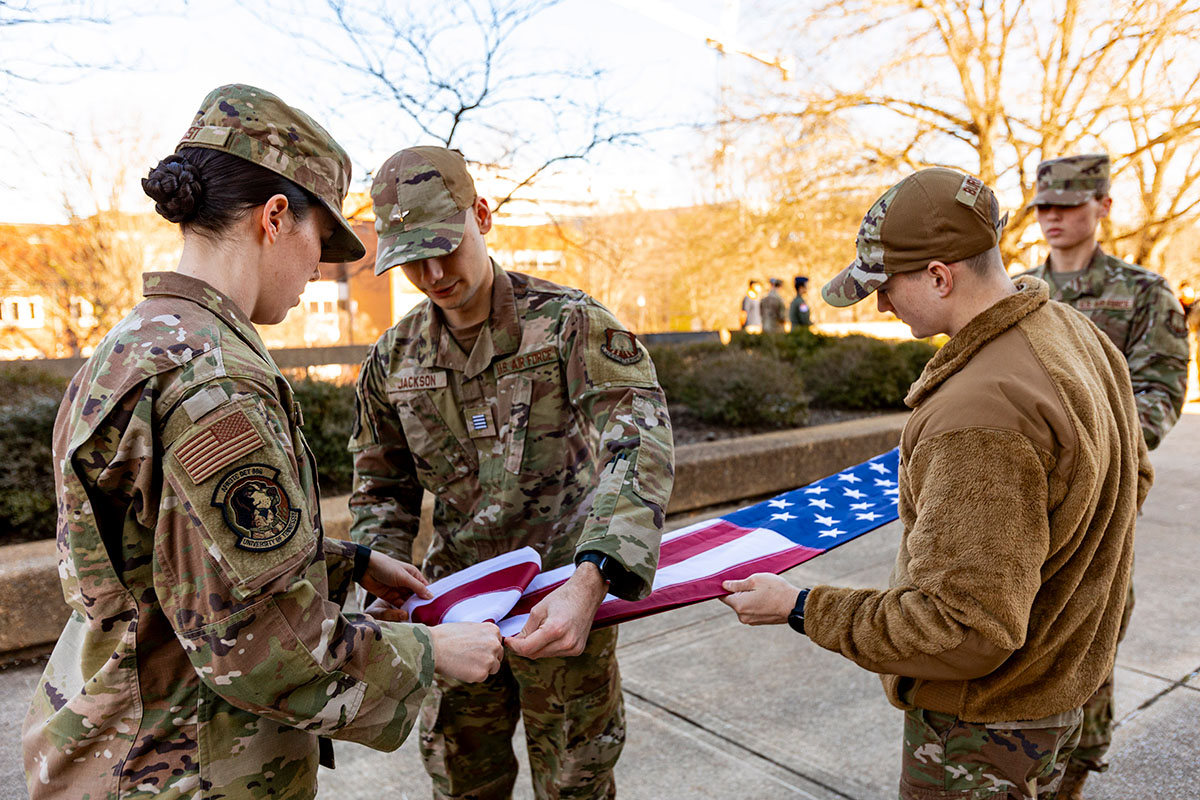Air Force ROTC Cadets practice flag folding in the Humanities Plaza. 