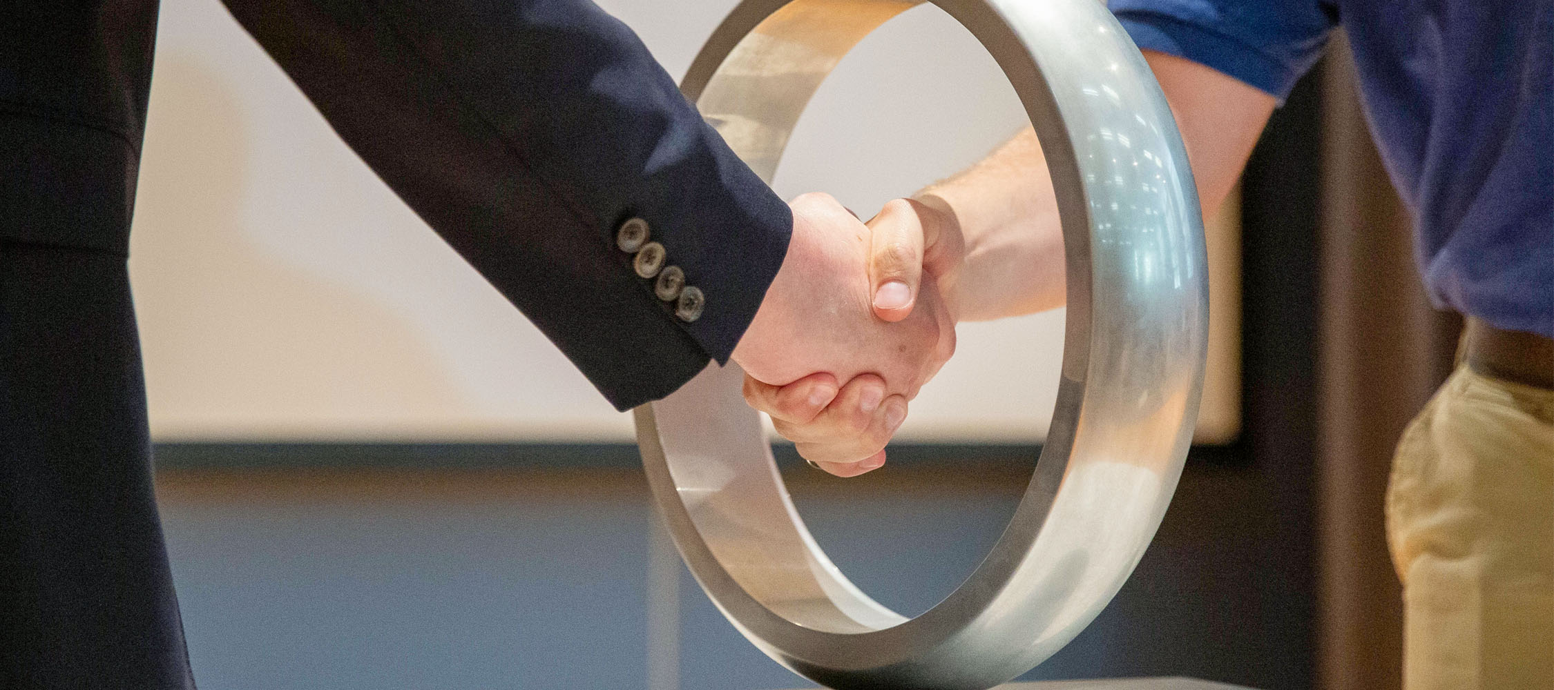 Students shake hands through the Order of the Engineer Ring