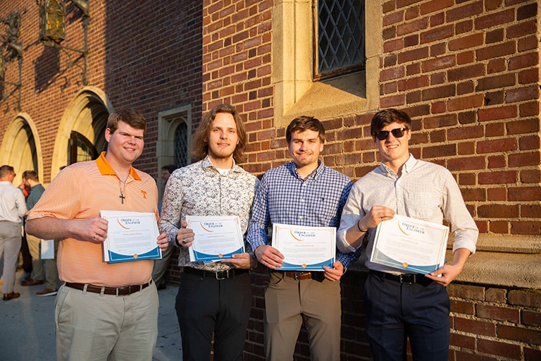 Student hold up their Order of the Engineer certificate.