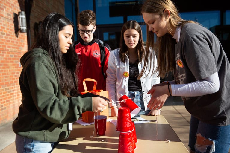 Students work on cup building competition. 