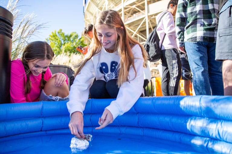 Students test their Penny Boat entry. 