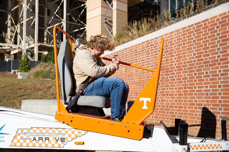 Student takes a ride on the Seat Belt Convincer
