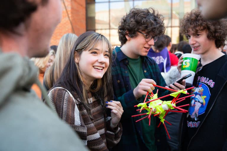 Students testing their egg drop competition entry. 