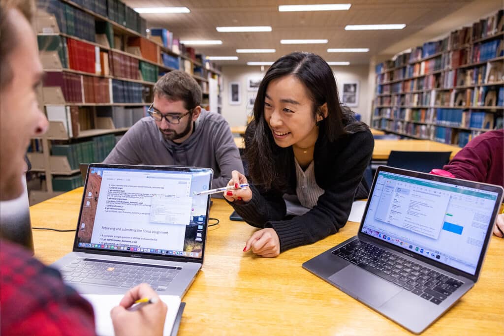 Grad students working in the 6th floor study area of Hodges Library