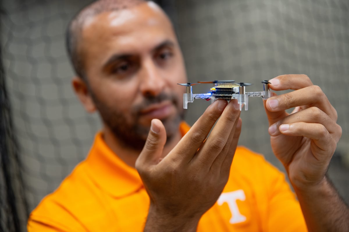 PhD student Sabrullah Deniz holds a nano drone in the Autonomous Systems Laboratory in the Nathan W. Dougherty Engineering Building