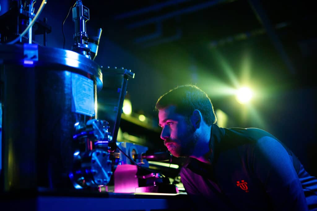 Materials science graduate student Reece Emery conducts a combinatorial thin film synthesis in Philip Rack’s sputtering lab at the Institute for Advanced Materials and Manufacturing