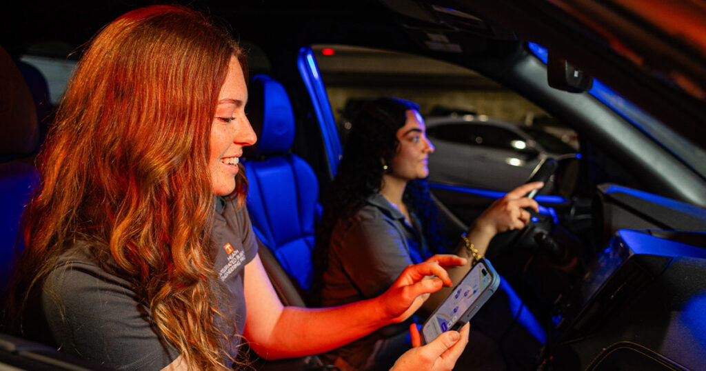 Students use the Vol Park app in a UT parking garage.