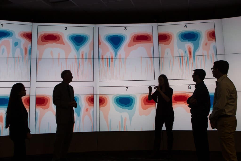 Lee Reidinger, director of the Bredesen Center for Interdisciplinary Research and Graduate Education, discussing big data climate studies research with ESE PhD students at ORNL.
