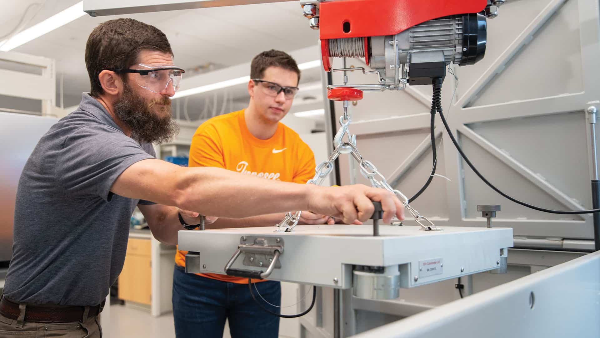 Doug Aaron and graduate student Preston Young use the Accelerating Rate Calorimeter (ARC) to test thermal runaway of lithium-ion batteries in a lab in Zeanah Engineering Complex