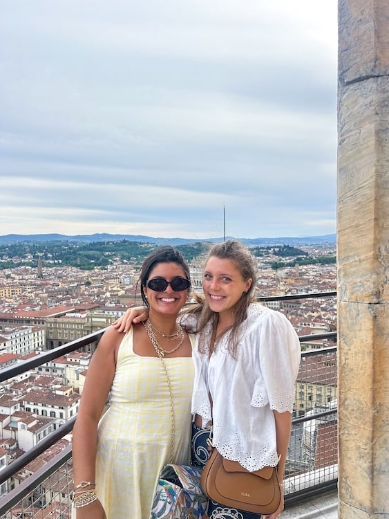 Emmy Castleberry and friend with Florence behind them