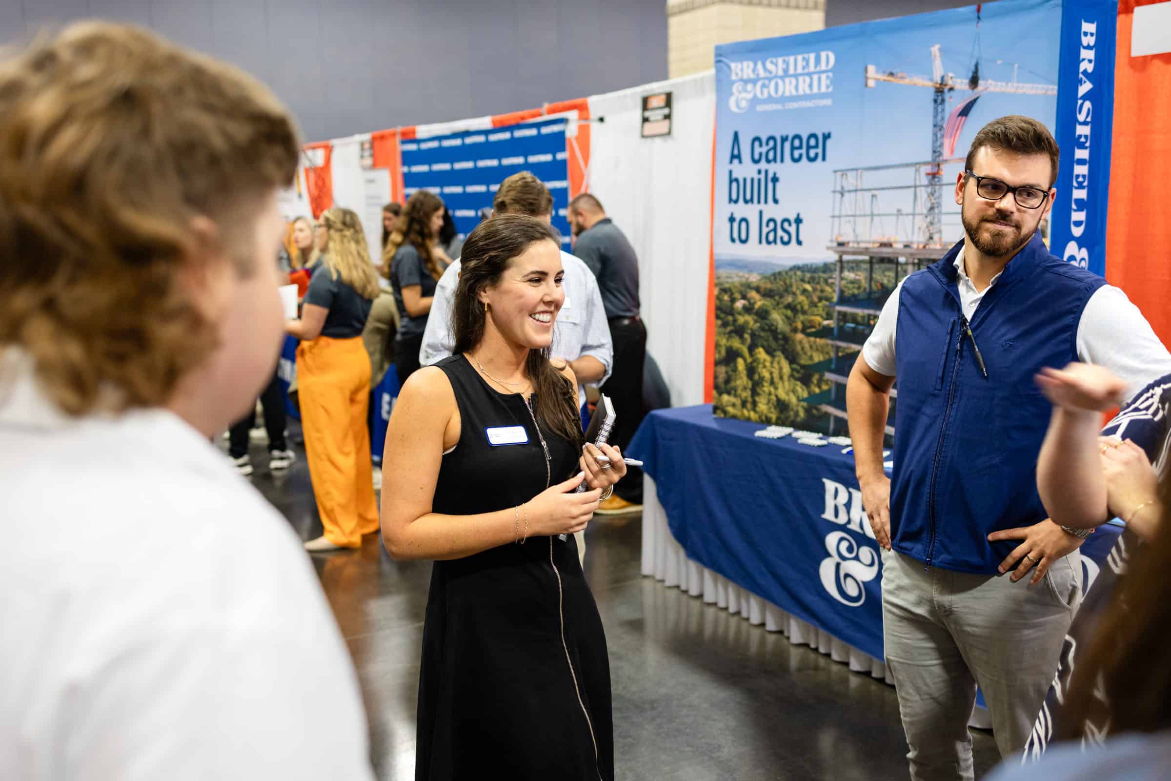 Students and company representatives network at the Engineering Expo