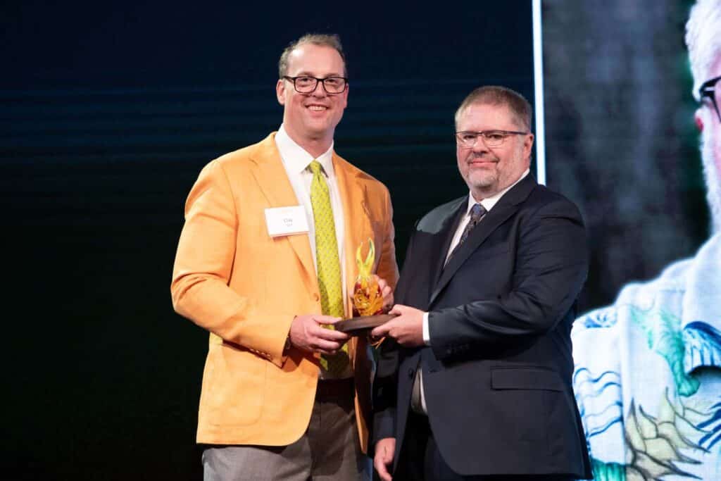 Michel Dodd accepts award at the Alumni Awards Gala.