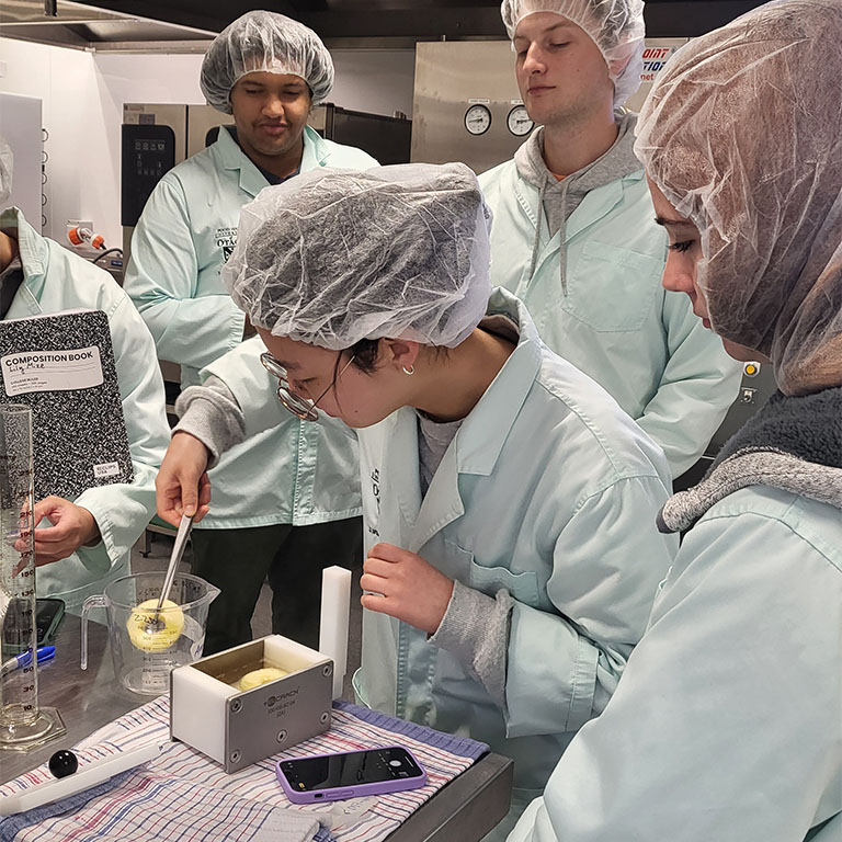Students testing apples in lab