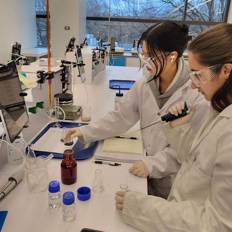 Students work with sample in lab