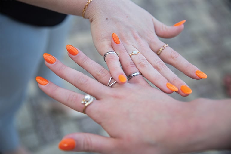 Two students show off their Order of the Engineer ring