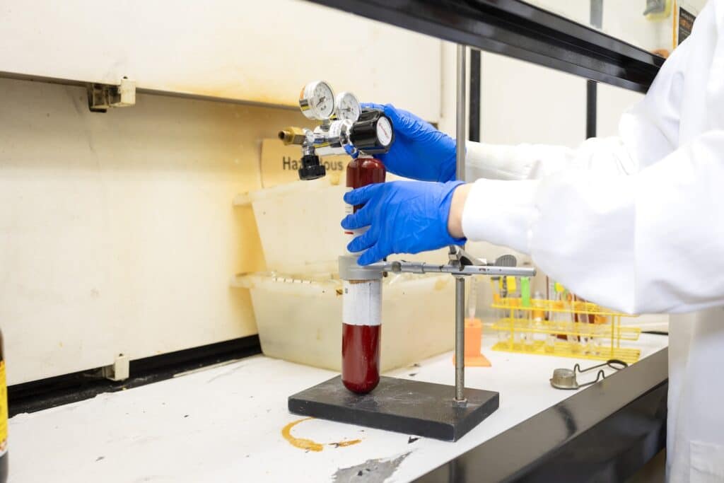 Guang He using equipment in the lab
