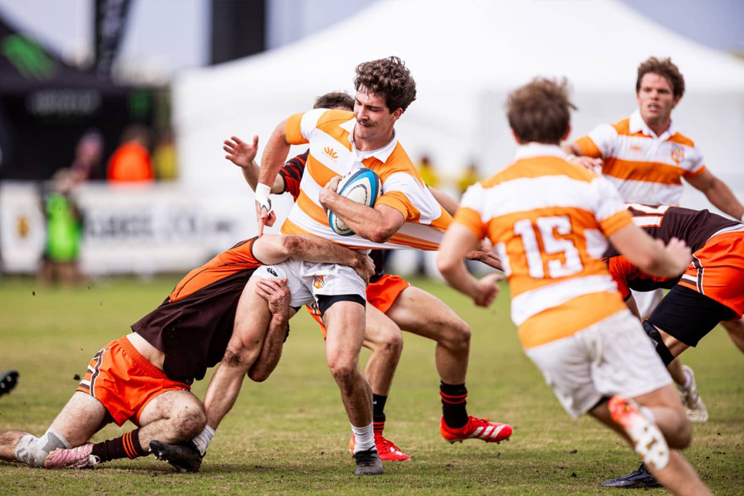 Joey Squirlock being tackled during rugby match. Photo courtesy of National Collegiate Rugby.