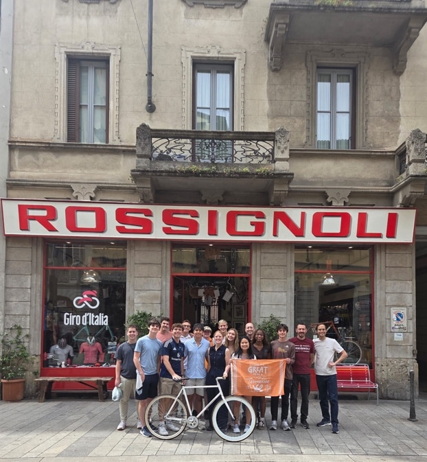 Students in the "Materials in Milan" study abroad group standing in front of the bicycle manufacturer, Rossignoli