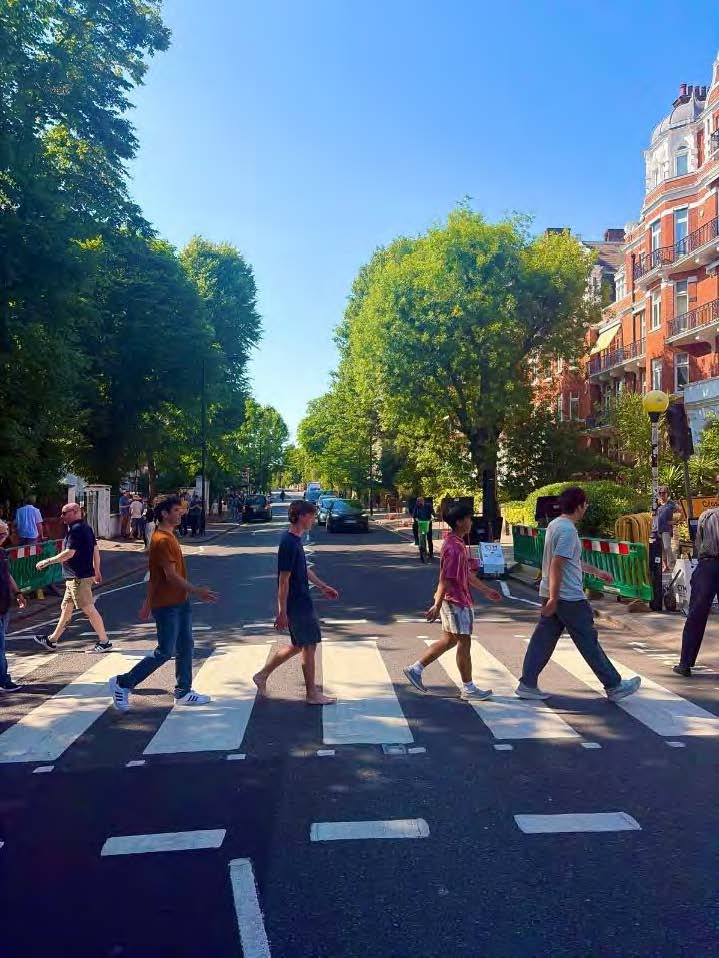 Novus and classmates recreating The Beatles' "Abbey Road" album cover.