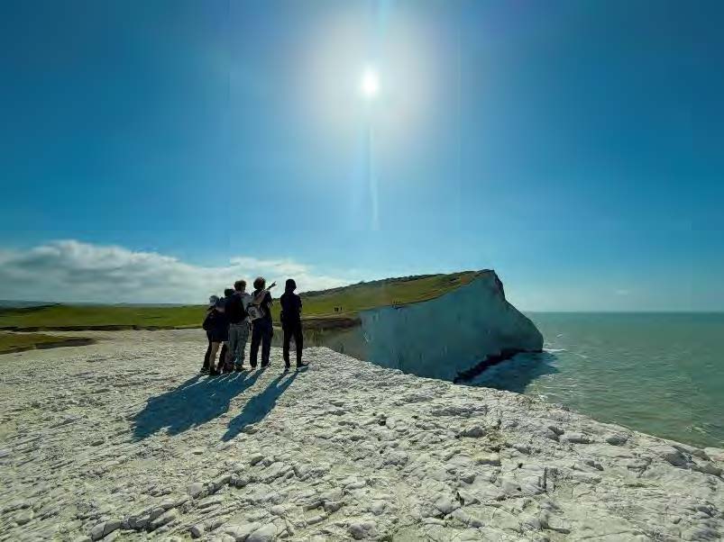 Novus and four other classmates looking over the Seven Sisters cliff